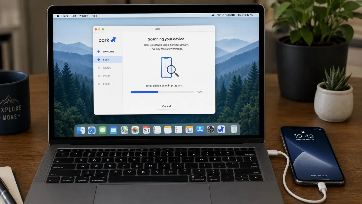 A laptop running the Bark desktop setup app with an iPhone connected by a Lightning cable, the screen showing a scan progress bar partway through the initial device scan.