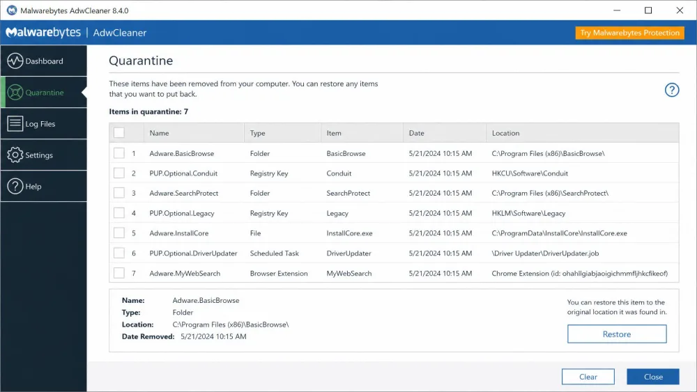 The AdwCleaner quarantine panel listing removed adware and PUP items with a Restore button, showing how a cleaned item can be recovered after a scan.