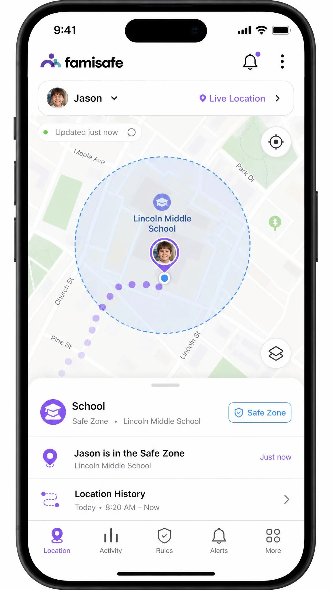 FamiSafe's parent app map view on a phone showing a child's live location pin inside a circular school safe zone, with a location history trail behind it.