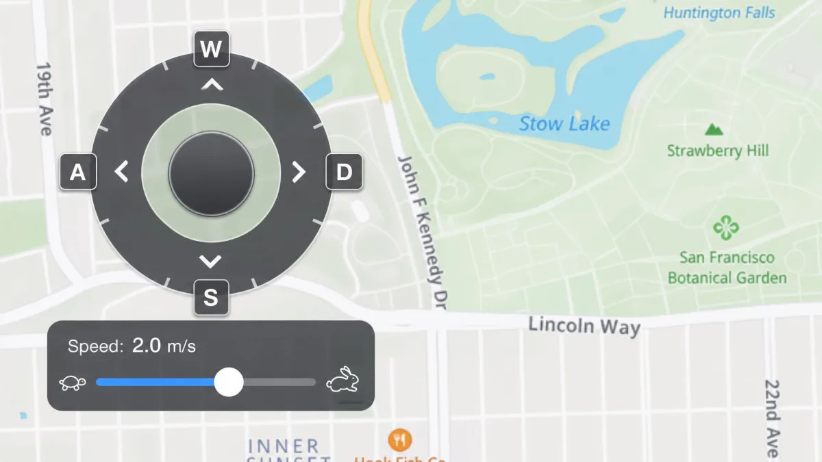 Close-up of MockGo's on-screen joystick overlay sitting on the map, with the direction ring, speed slider and W A S D key hints visible.