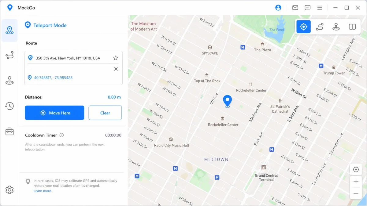 MockGo's teleport mode with an address typed into the search field, a pin dropped on the map and the blue Move Here button highlighted in the sidebar panel.