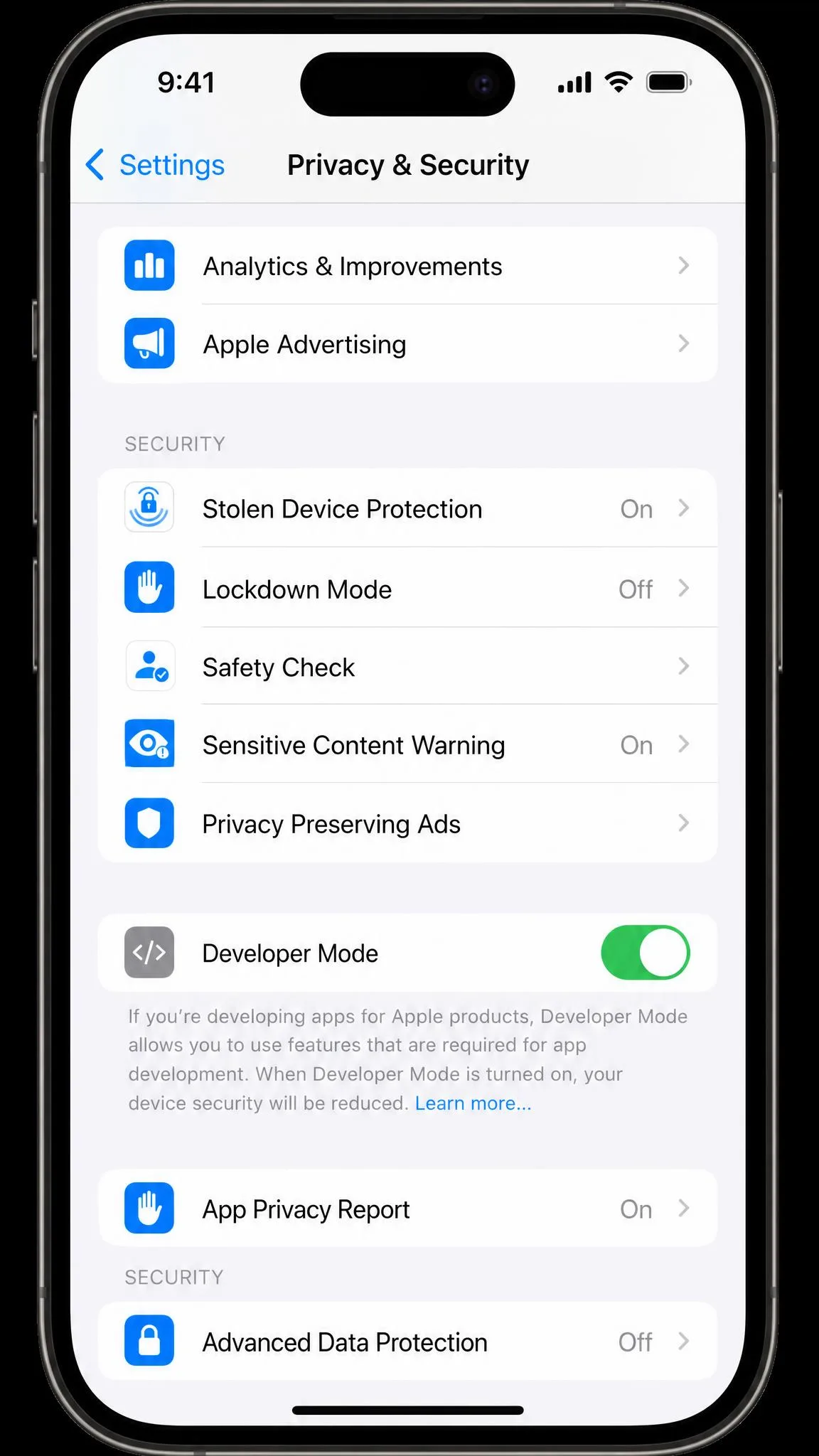 The iPhone Settings app open at Privacy and Security with the Developer Mode row visible and its toggle switched on, ready for the restart prompt.