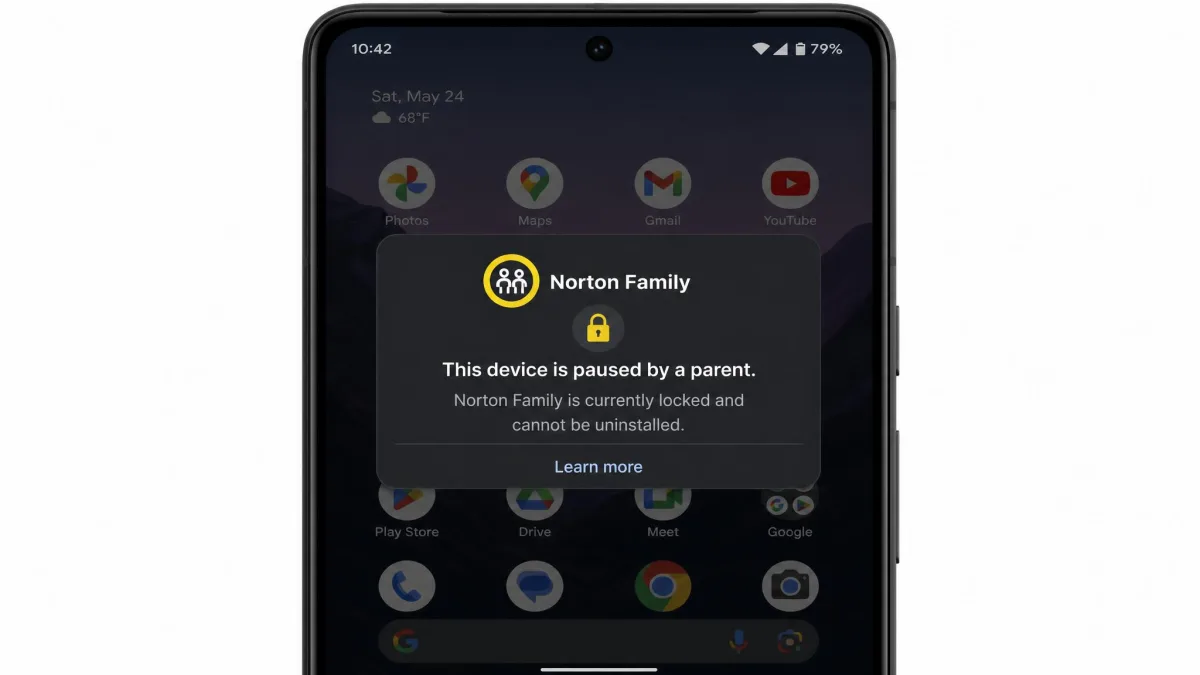 Android phone screen showing Norton Family's locked state with a message that the device is paused by a parent and cannot be uninstalled, over a dimmed home screen.