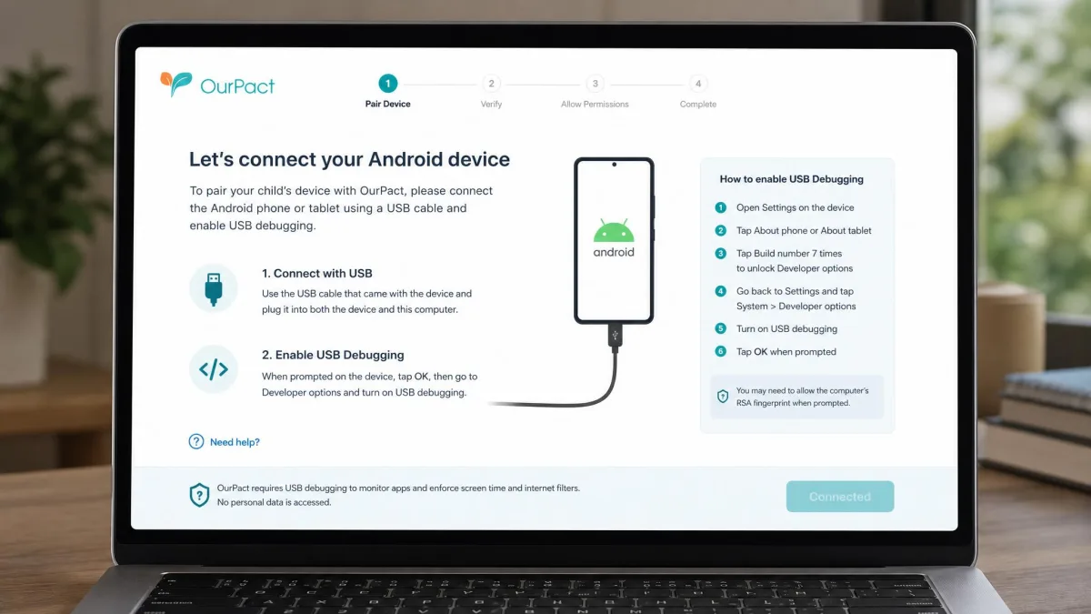 OurPact setup screen on a laptop prompting the parent to connect an Android phone by USB cable and enable USB debugging during initial device pairing.