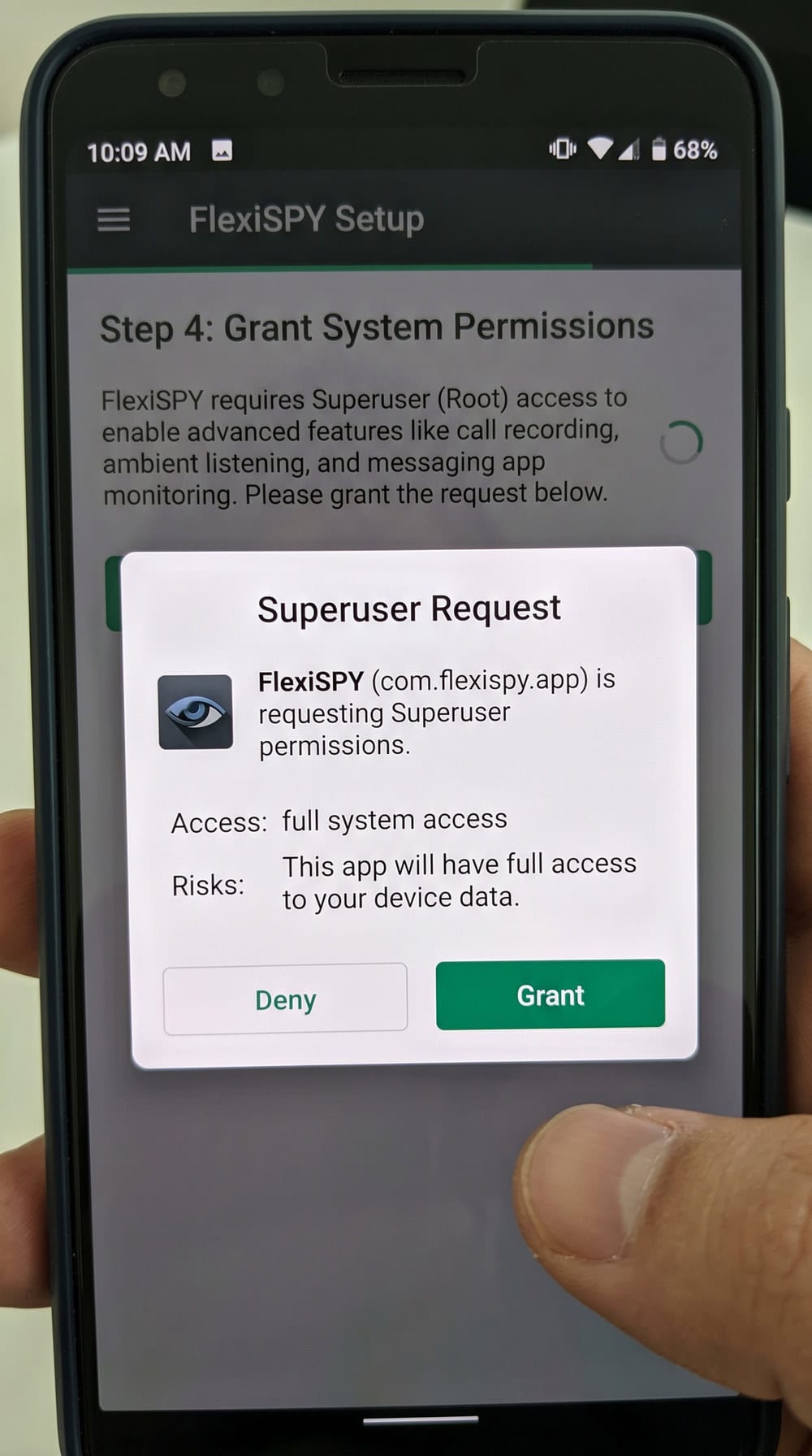 Android phone screen mid-installation of the FlexiSPY app, showing a permissions prompt during the setup process on a rooted handset.