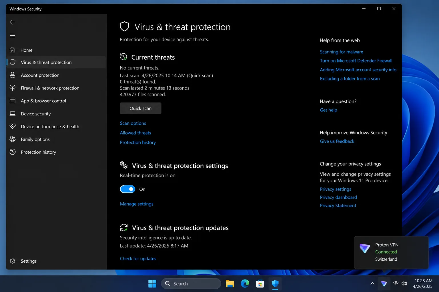 The Windows Security app's Virus & threat protection page with real-time protection on and Proton VPN in the tray.