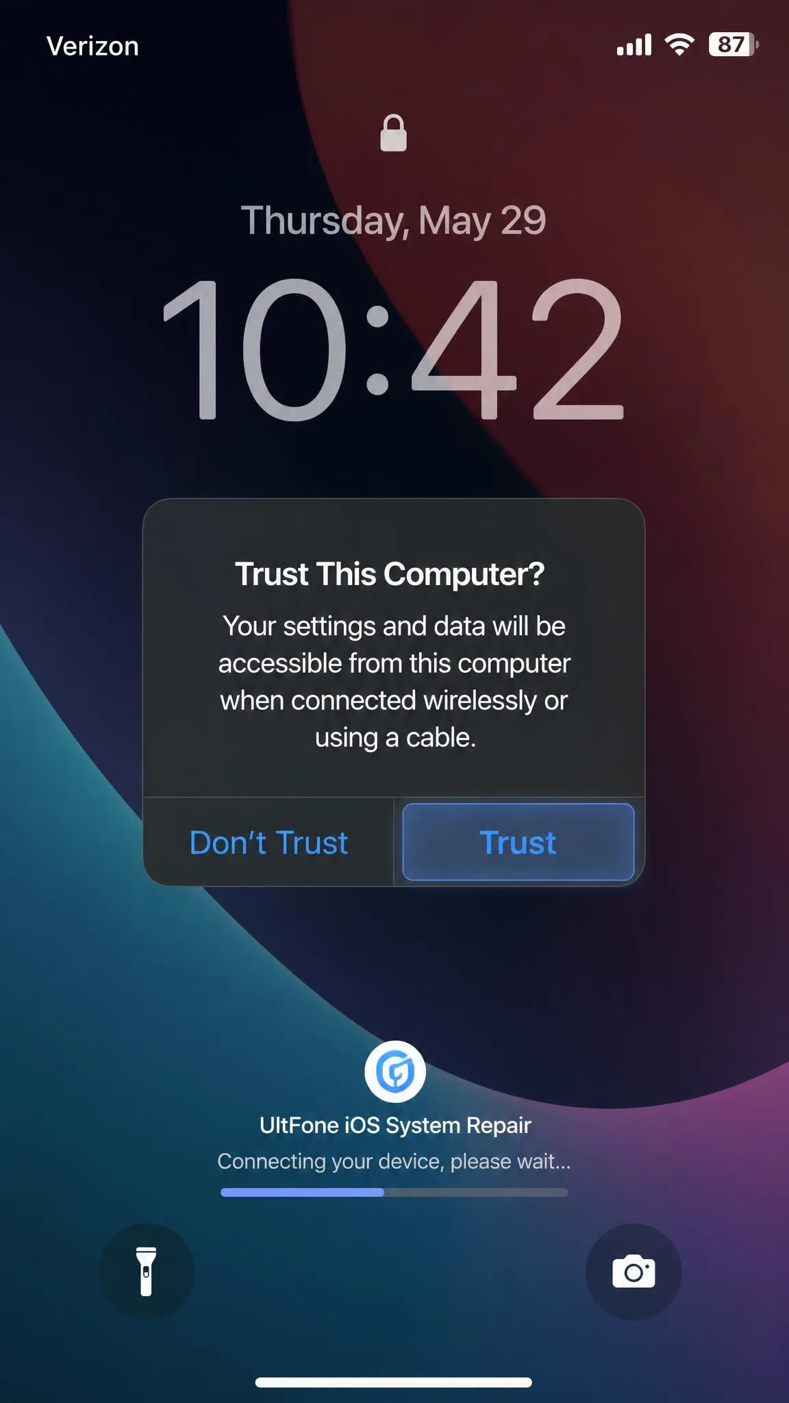 An iPhone lock screen showing the Trust This Computer dialog with the Trust button highlighted, taken during UltFone's connection step.