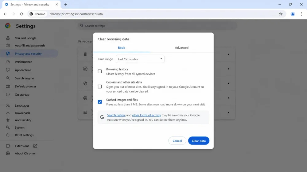 The Chrome Clear browsing data dialog open on desktop with the Cached images and files checkbox ticked and the time range set to the default 15 minutes.