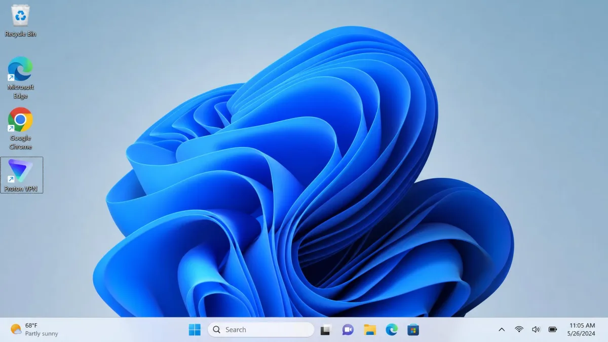 A Windows 11 desktop with the Proton VPN icon selected and no application window open, showing the moment when a double-click produces no visible response.