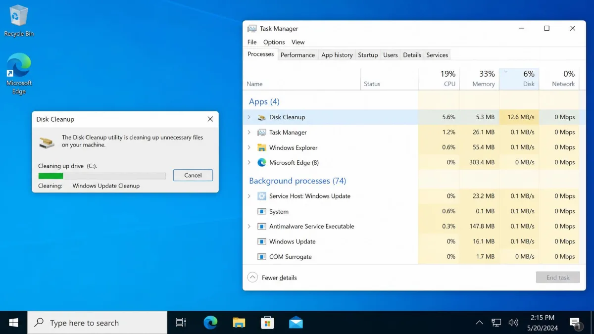 The Disk Cleanup progress window frozen on the Windows Update Cleanup step beside Task Manager showing the cleanmgr process still consuming disk and CPU time.