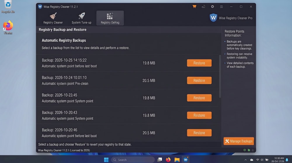 Wise Registry Cleaner backup and restore panel on Windows 11 listing dated automatic registry backups with a Restore button beside each entry.